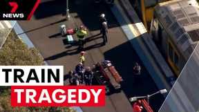 A child and man have died after a pram rolled onto train tracks | 7NEWS