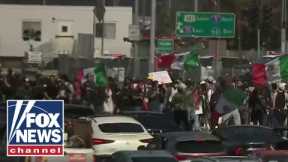 BREAKING: Rioters shut down California freeway