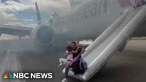 Video shows passengers evacuating American Airlines plane